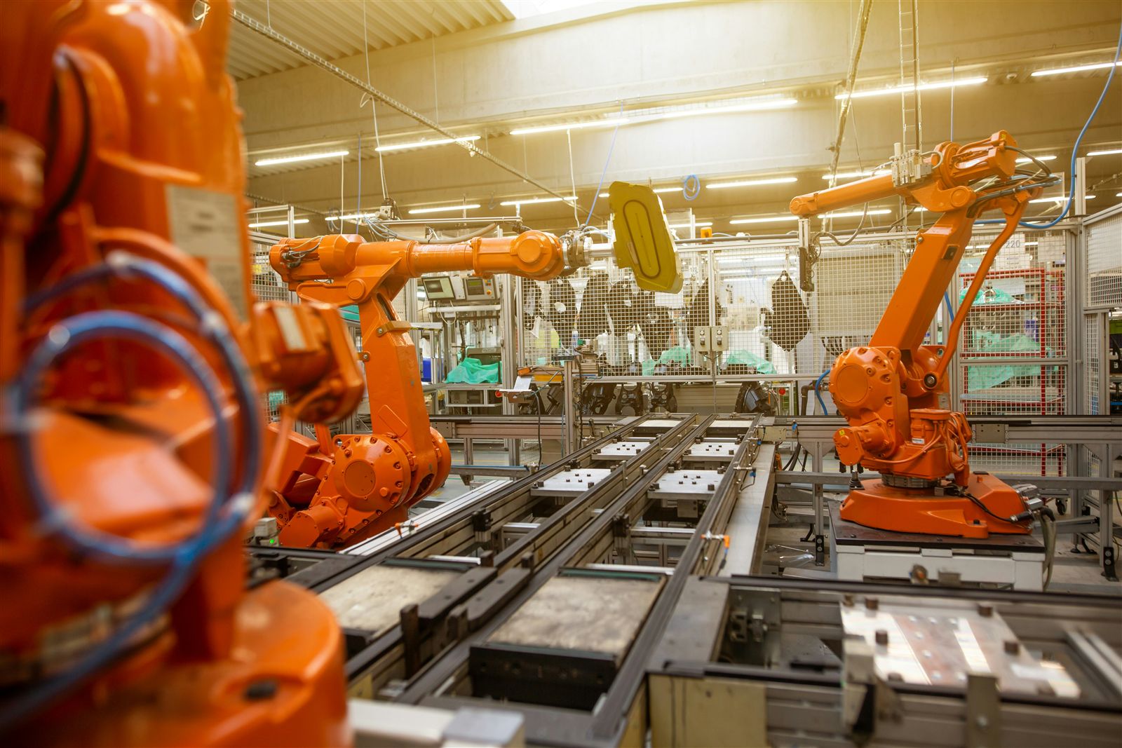 Robotic arms on a factory production line